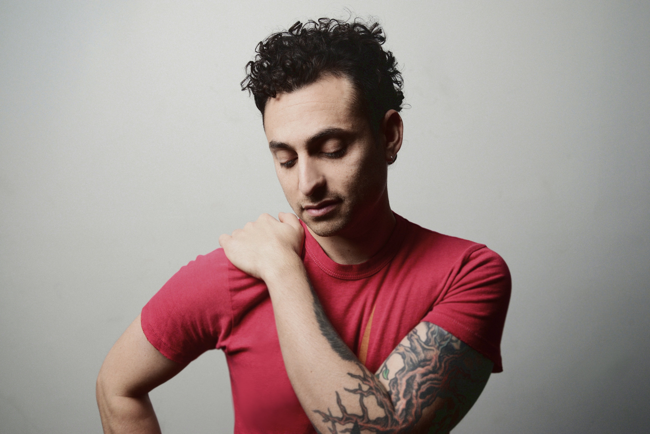 A soulful portrait of musician Keaton Simons with his guitar, capturing the essence of an artist at the intersection of rock, blues, and storytelling.