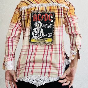 Upcycled AC/DC flannel shirt with 1988 World Tour back patch, leopard print border, hand-bleached yellow ombré, and vintage white lace trim.