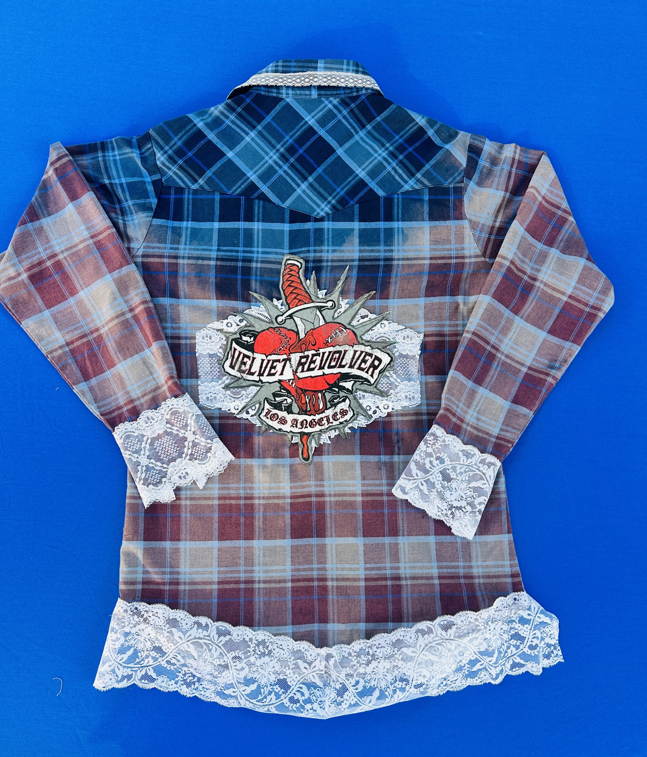 Upcycled Velvet Revolver flannel shirt with teal and blue bleached ombré, vintage white lace cuffs and hem, and a rock band back patch.